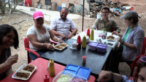 A table of folks enjoying tacos